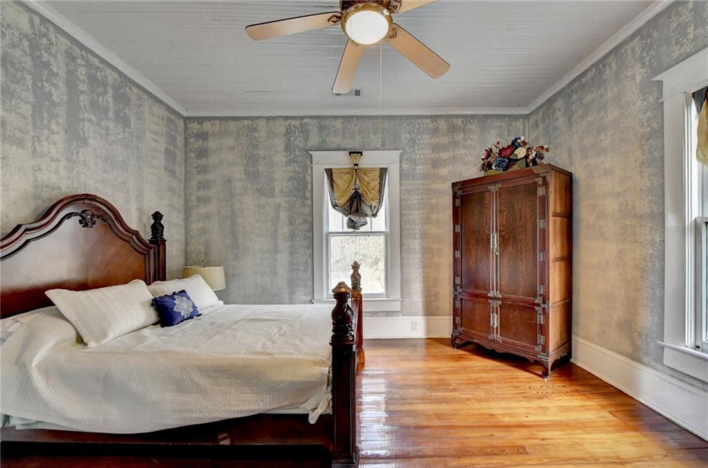 221 Plainview Road Jefferson, GA 30549 - Photo 48 of 87 a bedroom with a bed and a chandelier