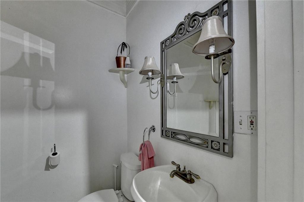 221 Plainview Road Jefferson, GA 30549 - Photo 61 of 87 a bathroom with a sink and mirror with toilet
