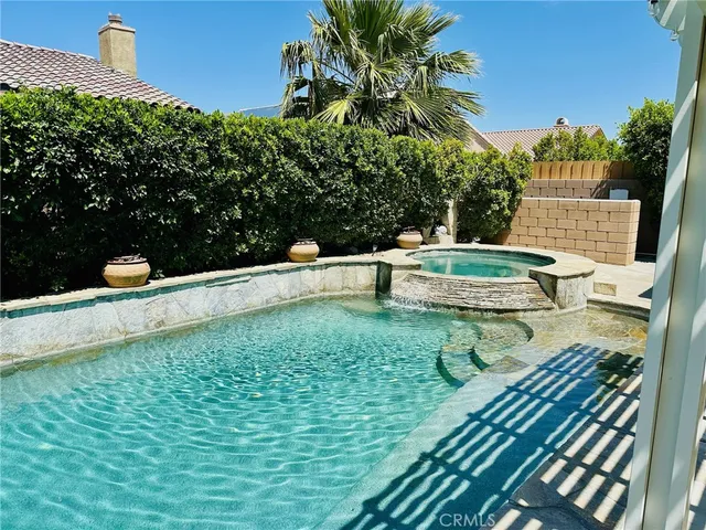 a view of a backyard with sitting area