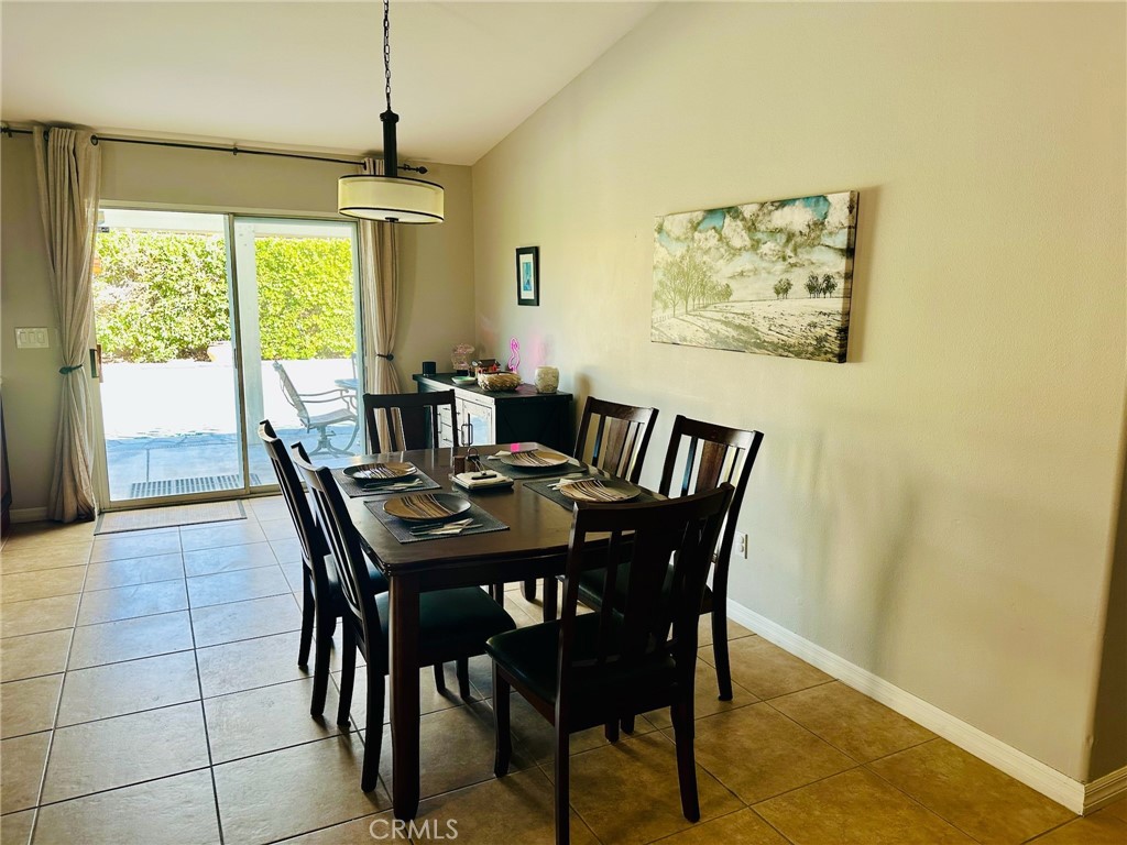 67810 Ontina Road Cathedral City, CA 92234 - Photo 16 of 43 a view of a dining room with furniture window and outside view