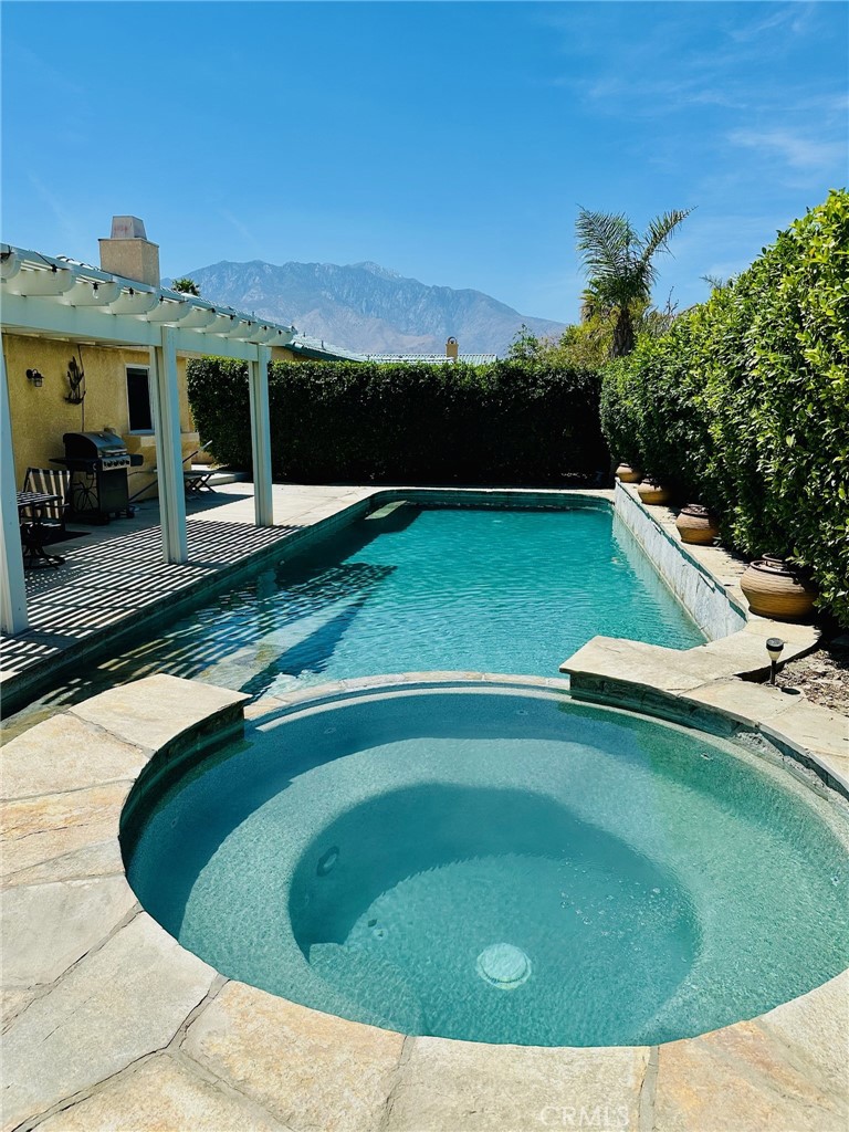 67810 Ontina Road Cathedral City, CA 92234 - Photo 2 of 43 a view of a swimming pool with a yard