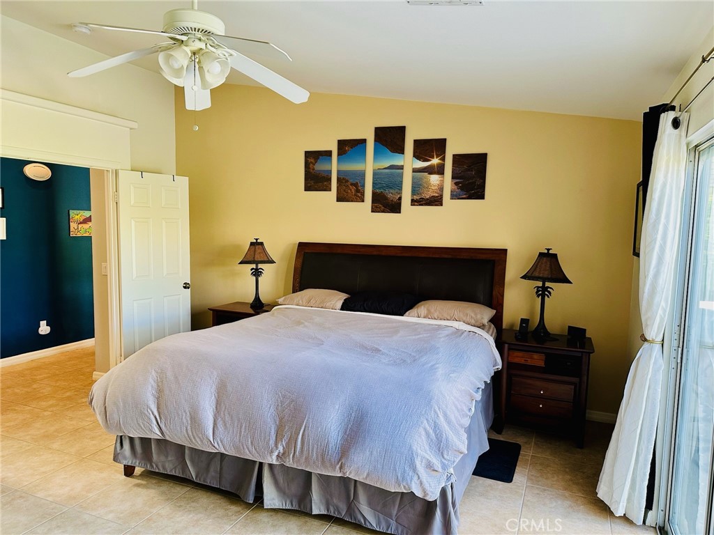 67810 Ontina Road Cathedral City, CA 92234 - Photo 21 of 43 a bedroom with a bed and a walk in closet