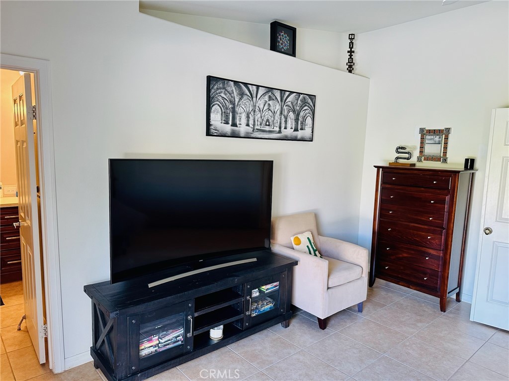 67810 Ontina Road Cathedral City, CA 92234 - Photo 22 of 43 a living room with furniture and a flat screen tv