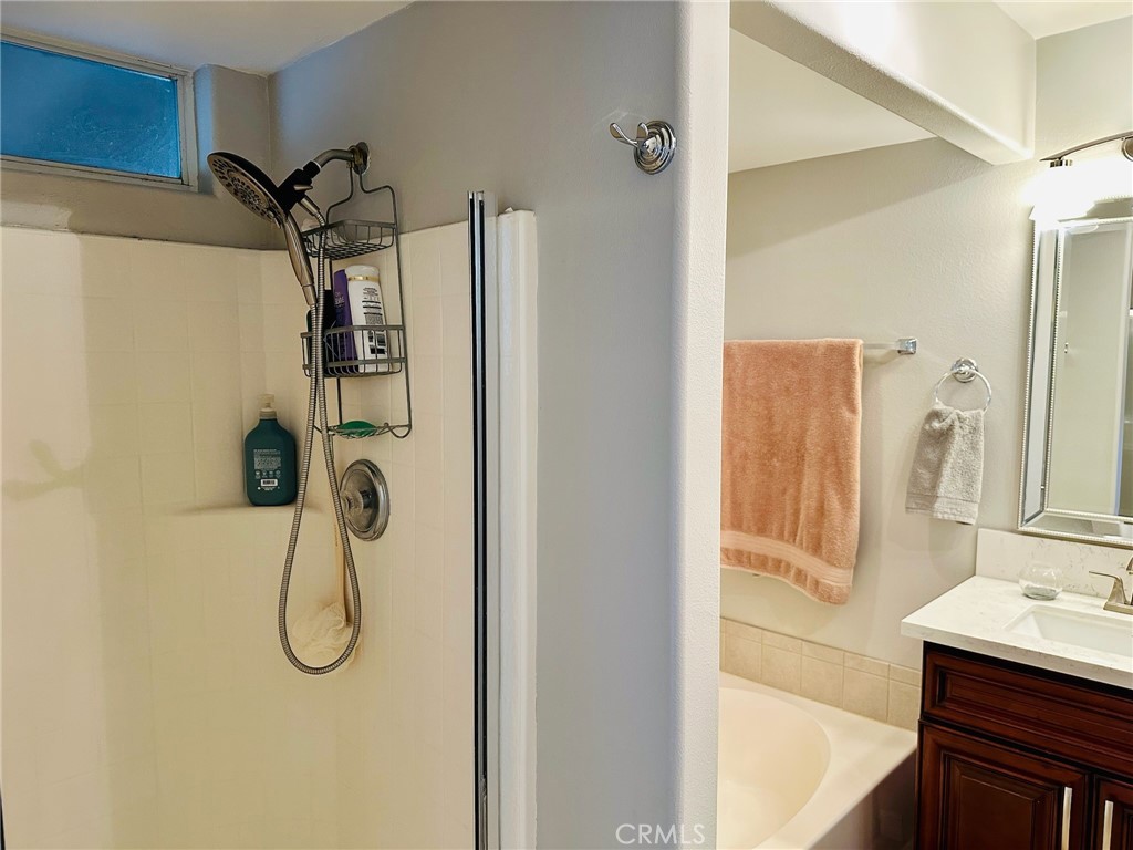 67810 Ontina Road Cathedral City, CA 92234 - Photo 24 of 43 a bathroom with a shower and a sink