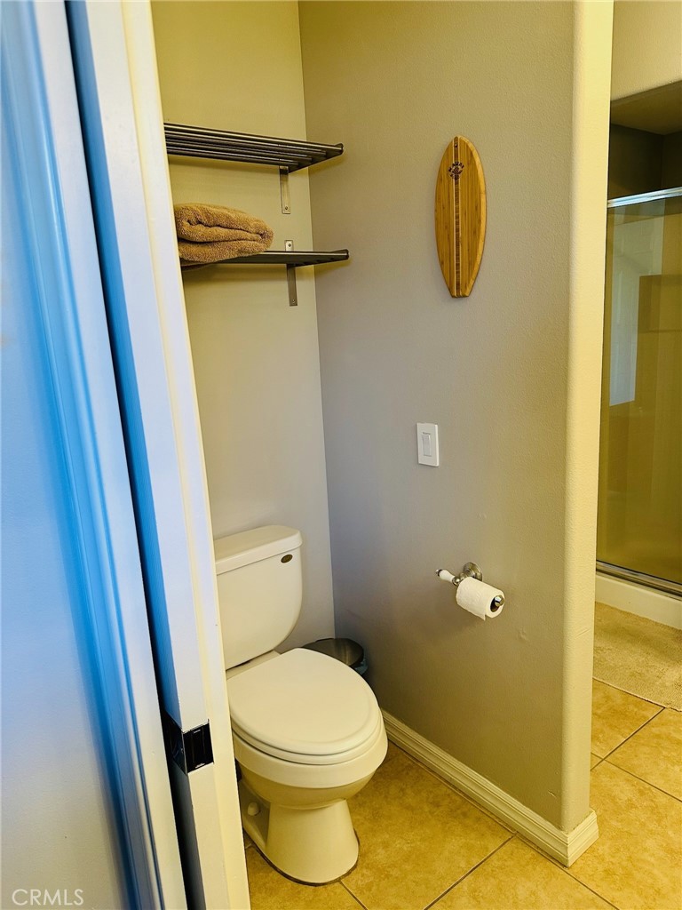 67810 Ontina Road Cathedral City, CA 92234 - Photo 25 of 43 a bathroom with a toilet and a shower