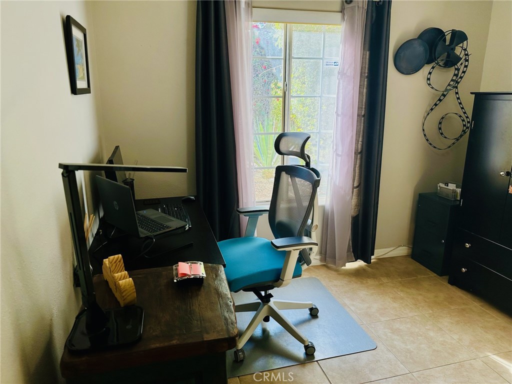 67810 Ontina Road Cathedral City, CA 92234 - Photo 28 of 43 a living room with furniture and a window
