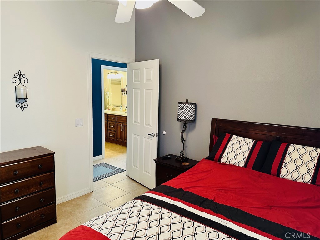 67810 Ontina Road Cathedral City, CA 92234 - Photo 33 of 43 a bedroom with a bed and a dresser