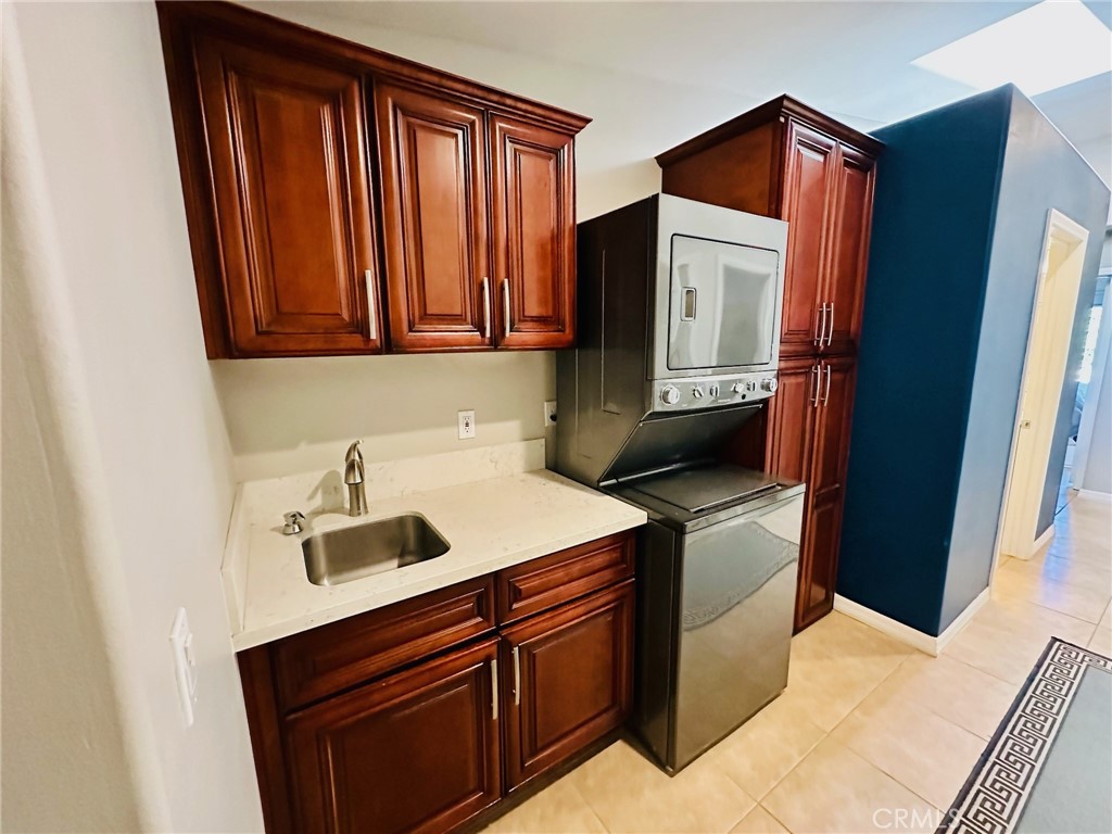 67810 Ontina Road Cathedral City, CA 92234 - Photo 36 of 43 a kitchen with a sink and a refrigerator