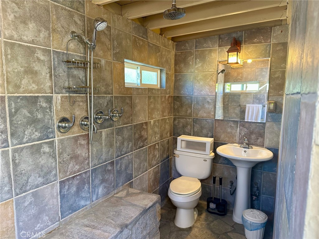 67810 Ontina Road Cathedral City, CA 92234 - Photo 39 of 43 a bathroom with a toilet sink and shower