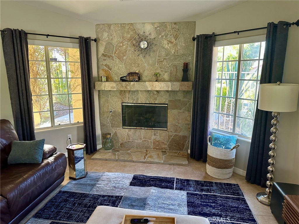 67810 Ontina Road Cathedral City, CA 92234 - Photo 7 of 43 a living room with furniture and a fireplace