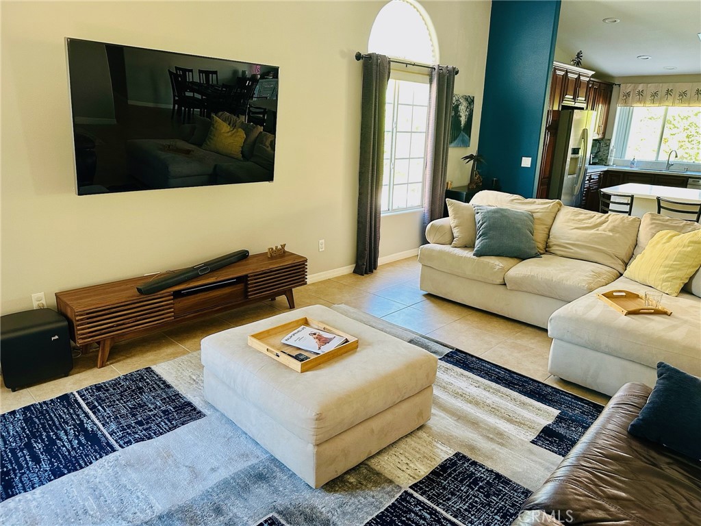 67810 Ontina Road Cathedral City, CA 92234 - Photo 9 of 43 a living room with furniture and a flat screen tv