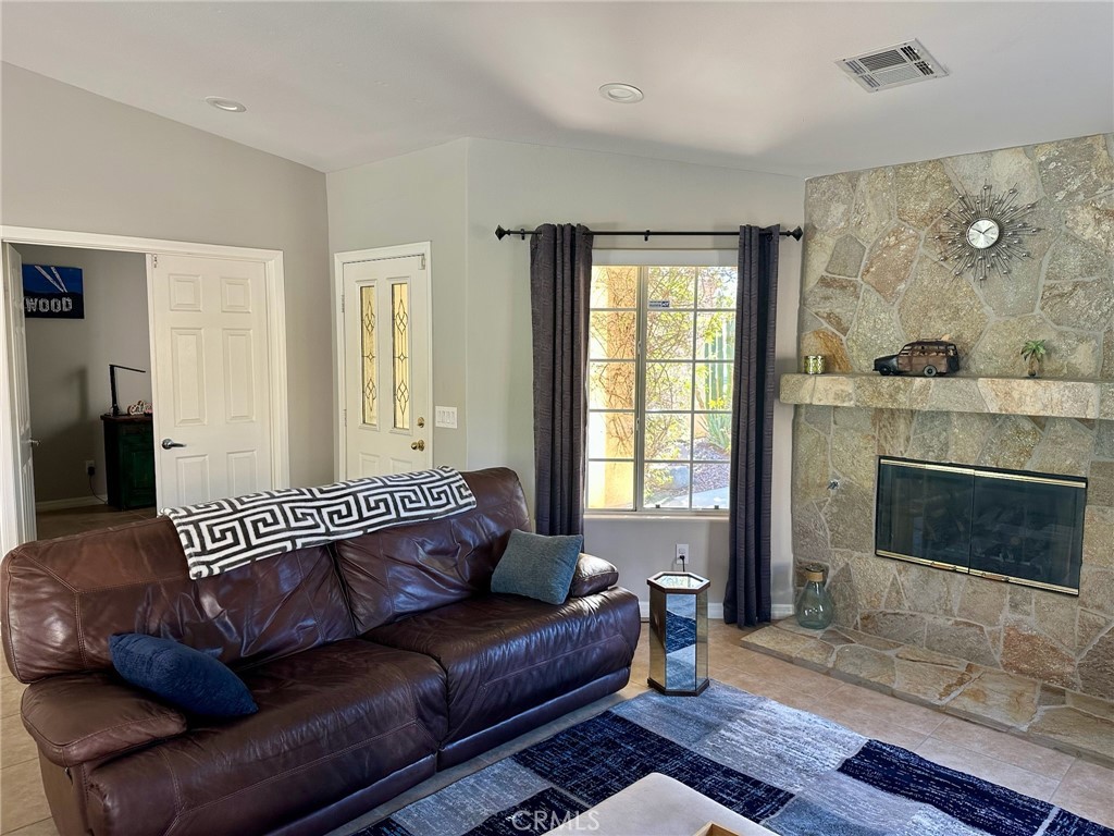 67810 Ontina Road Cathedral City, CA 92234 - Photo 10 of 43 a living room with furniture and a fireplace