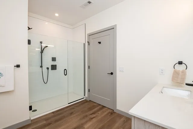 a bathroom with a granite countertop sink