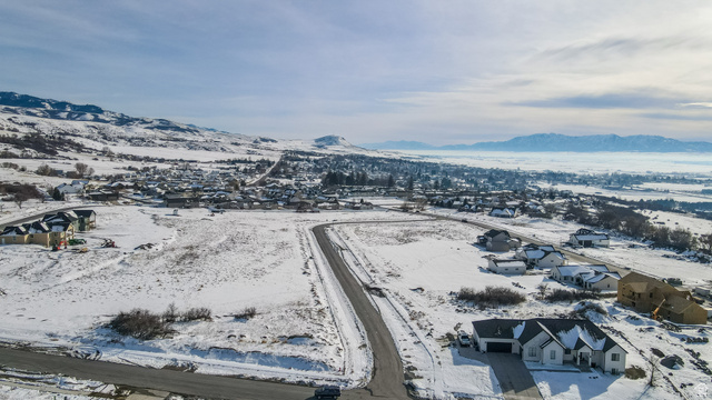 681 Cherry Ridge Lane, Unit 45 Richmond, UT 84333 - Photo 3 of 10 Snowy aerial view with a mountain view and a residential view