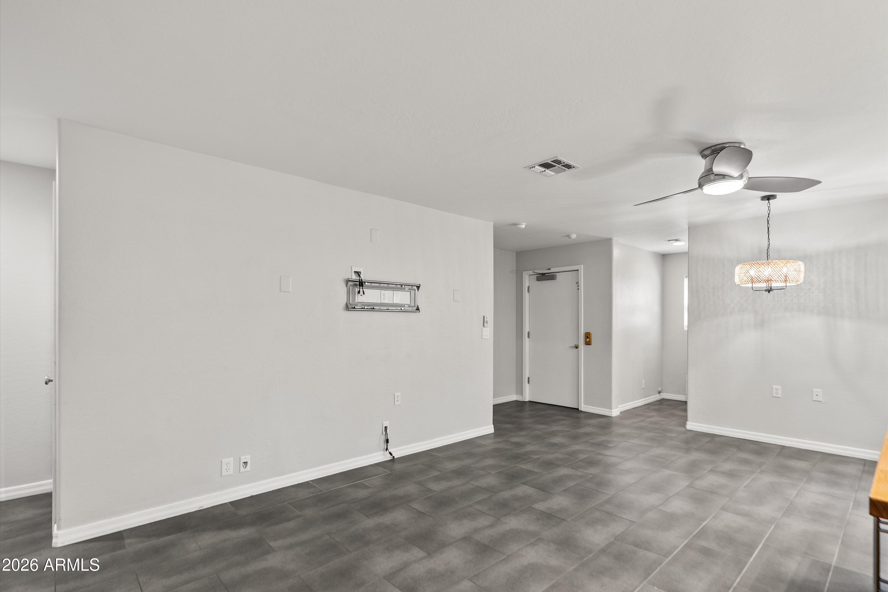 15649 North 29th Place Phoenix, AZ 85032 - Photo 12 of 35 a view of a chandelier fan and entryway