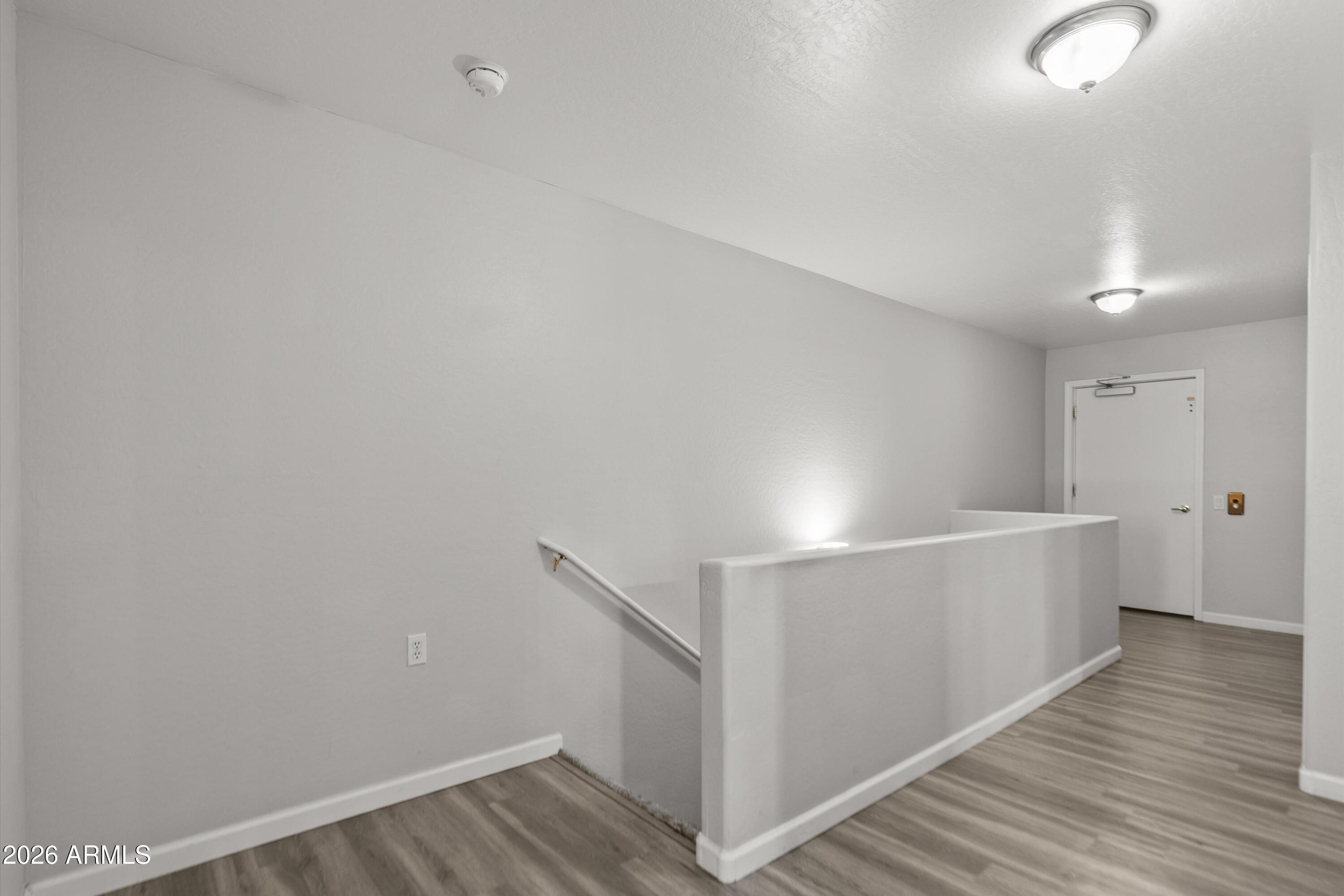 15649 North 29th Place Phoenix, AZ 85032 - Photo 18 of 35 a view of a room with wooden floor
