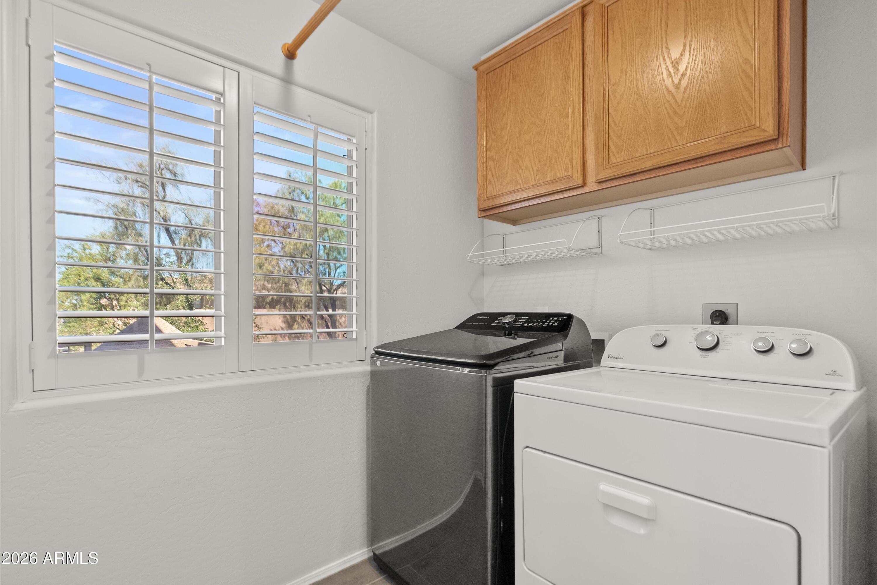 15649 North 29th Place Phoenix, AZ 85032 - Photo 24 of 35 a view of storage and utility room with washer and dryer