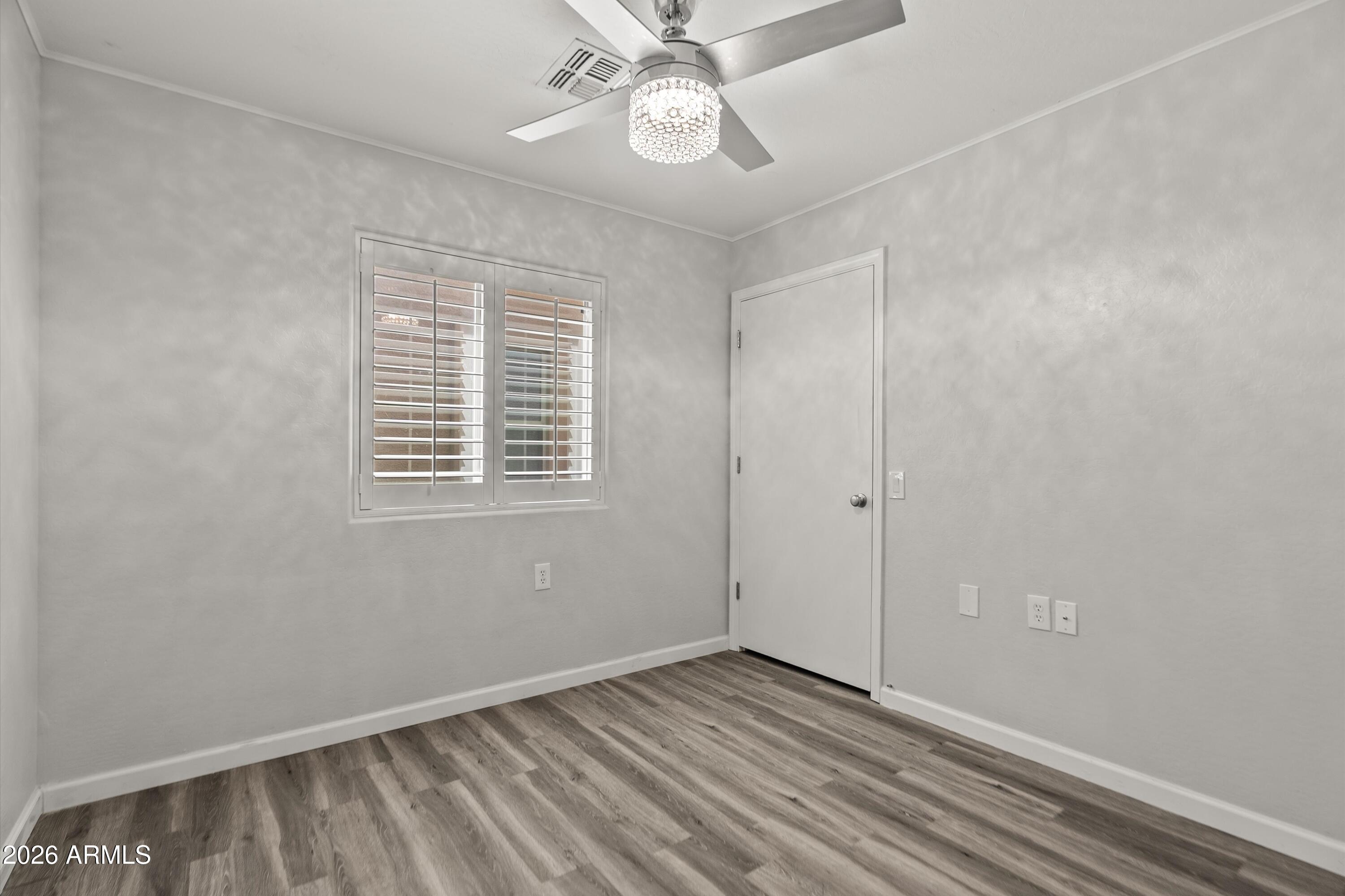 15649 North 29th Place Phoenix, AZ 85032 - Photo 25 of 35 a view of an empty room with a window