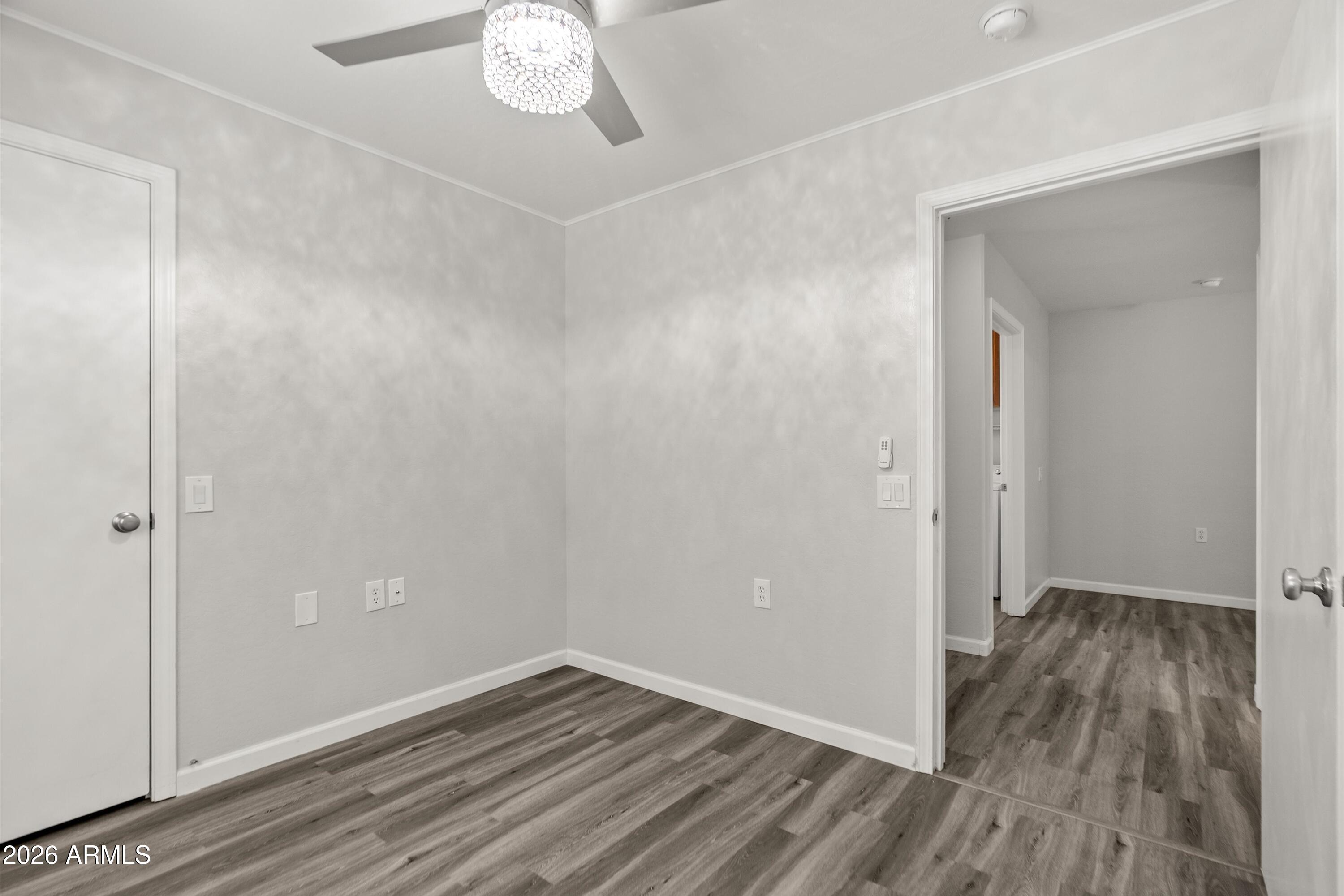 15649 North 29th Place Phoenix, AZ 85032 - Photo 26 of 35 a view of a room with wooden floor