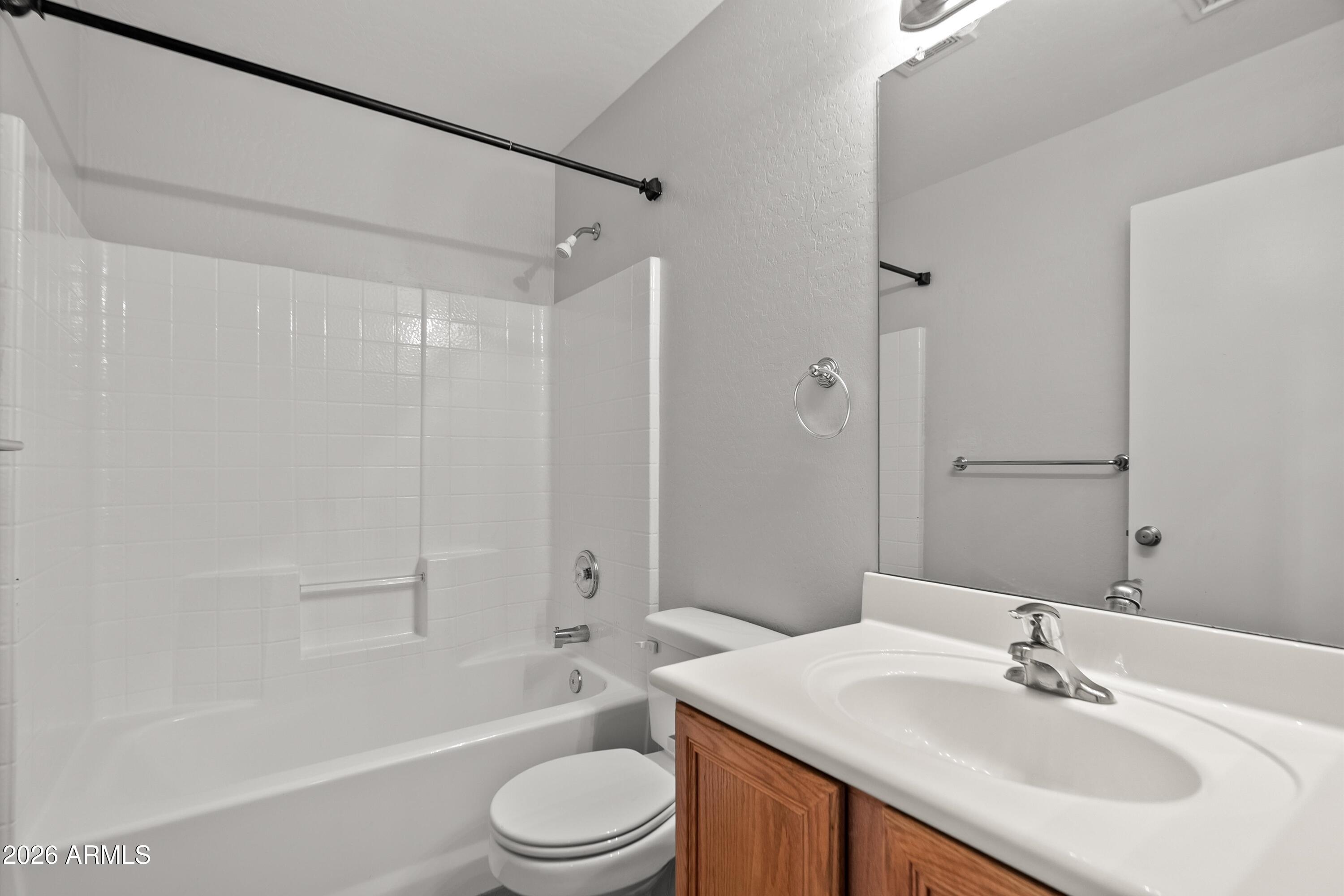 15649 North 29th Place Phoenix, AZ 85032 - Photo 27 of 35 a bathroom with a sink a toilet and shower