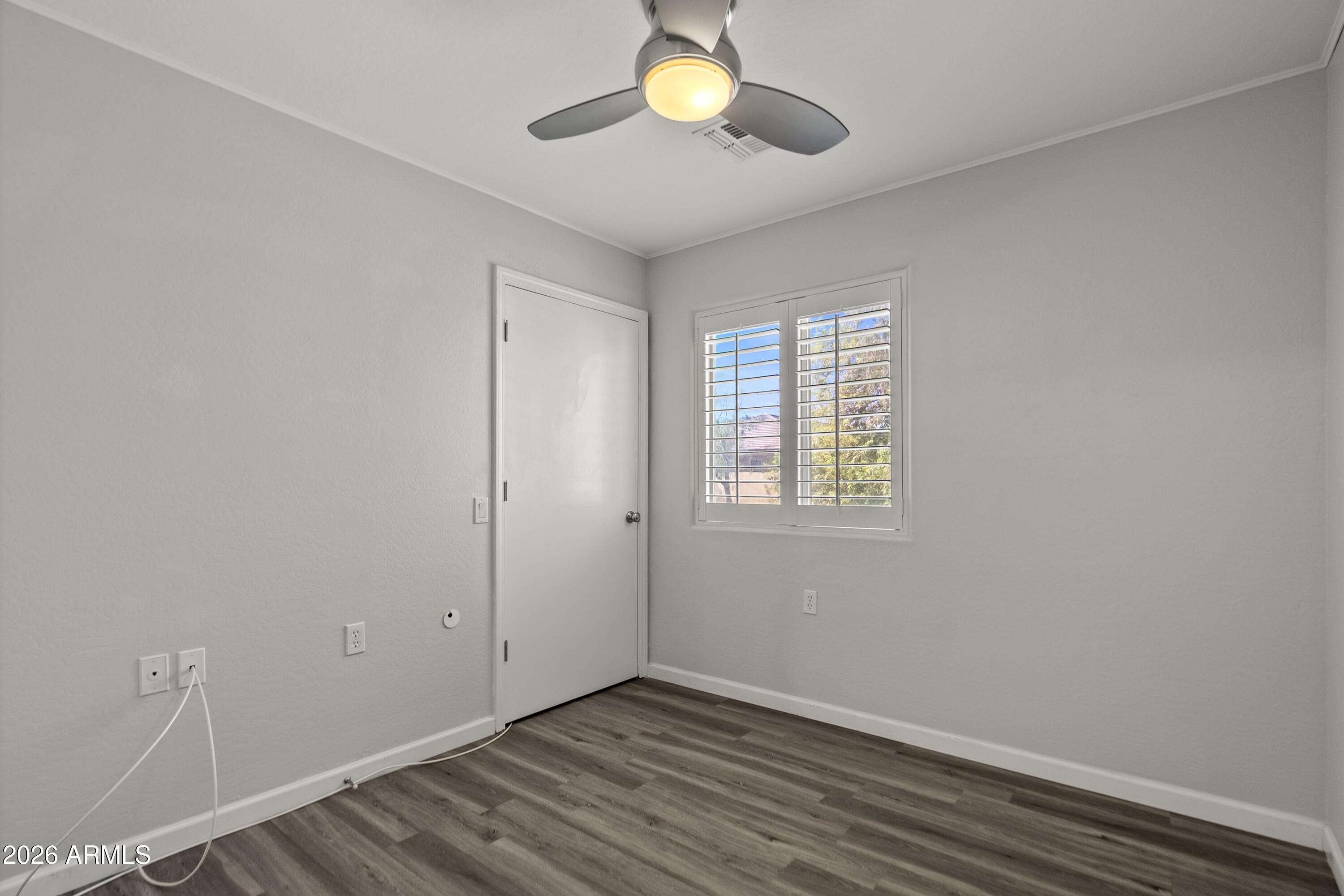 15649 North 29th Place Phoenix, AZ 85032 - Photo 28 of 35 wooden floor in an empty room with a window