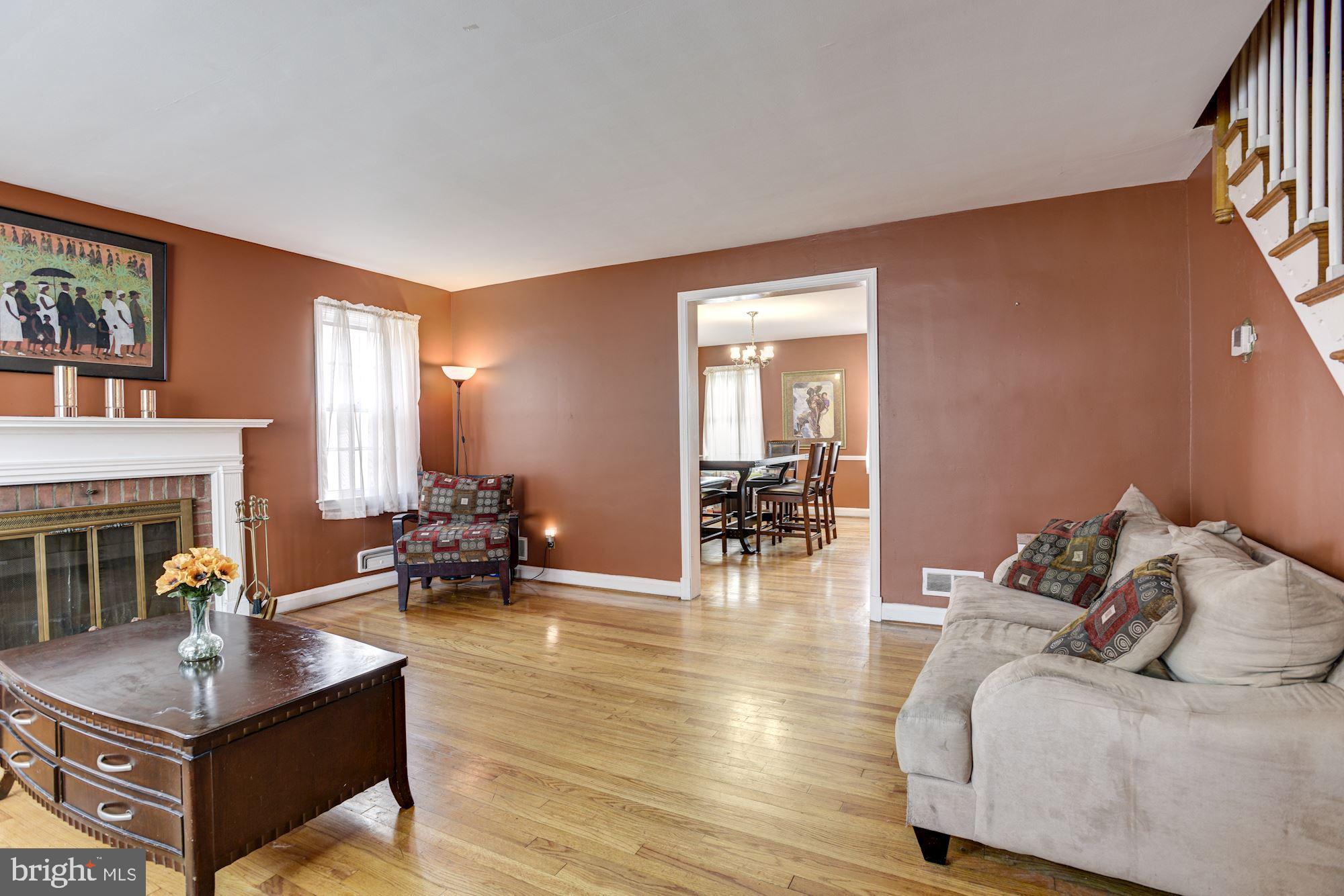 1645 Northbourne Road Baltimore, MD 21239 - Photo 3 of 21 Living Room | Hardwood Floors | Fireplace