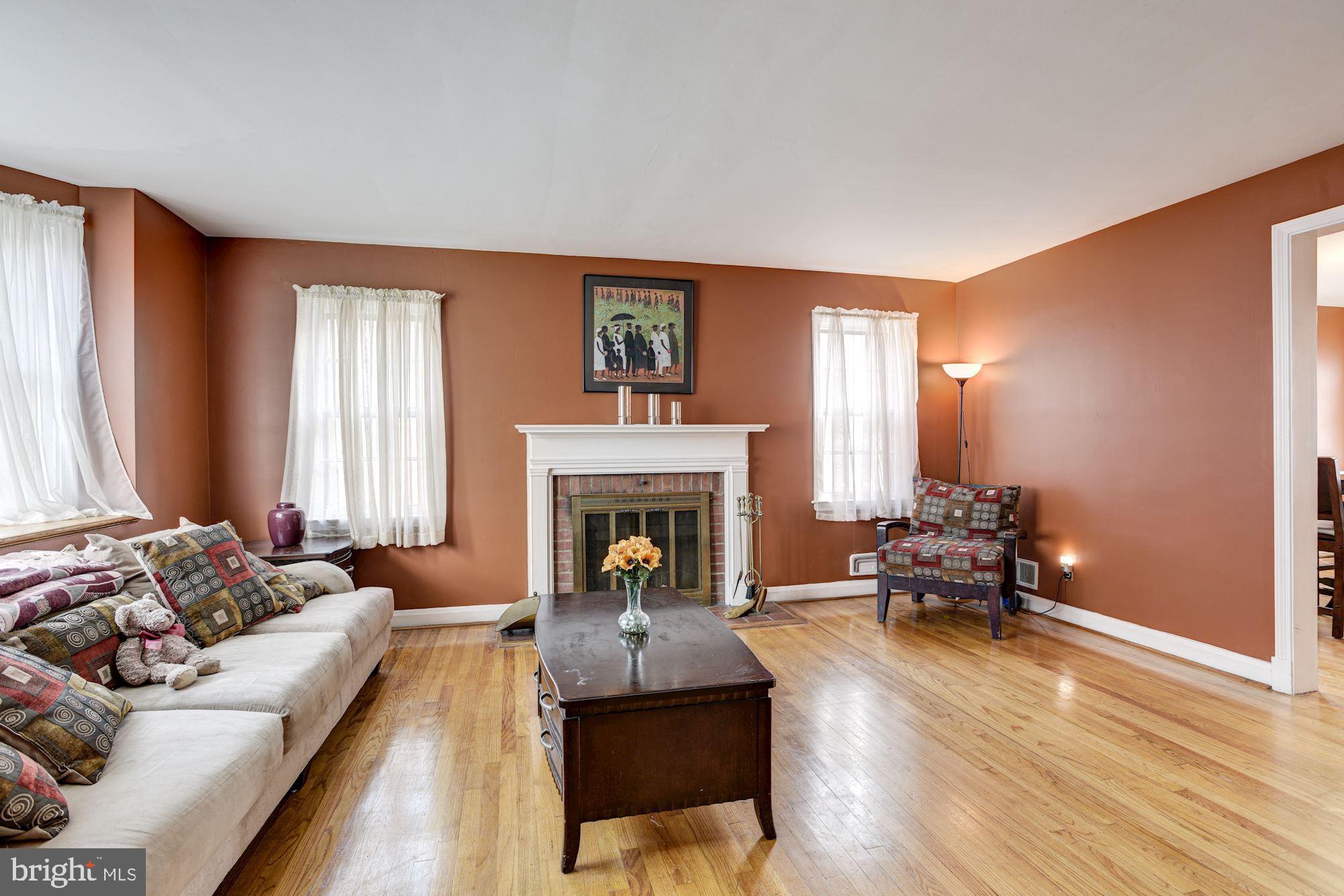 1645 Northbourne Road Baltimore, MD 21239 - Photo 4 of 21 Living Room | Hardwood Floors | Fireplace