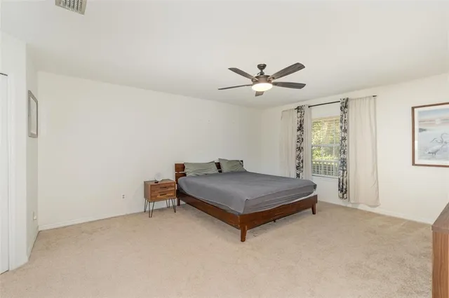 a room with a bed and window