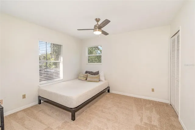 a bedroom with a bed and window