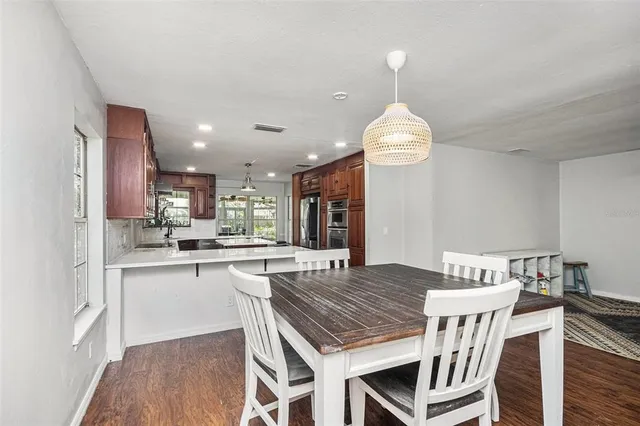 a kitchen with a table and chairs in it