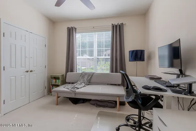 a bedroom with bed and a book shelf