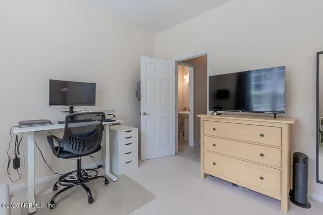a spacious bathroom with a double vanity sink and a mirror