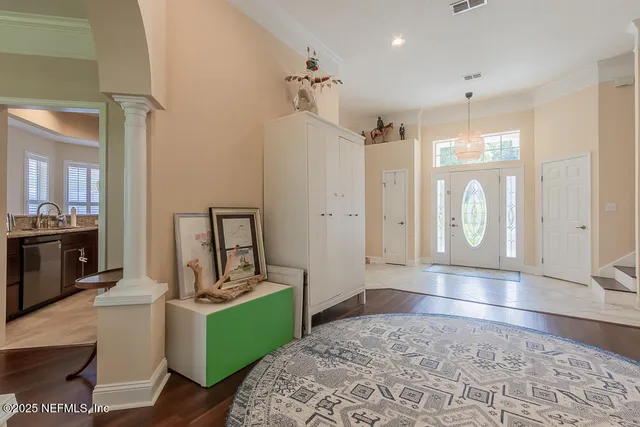 a view of a dining room with furniture and windows