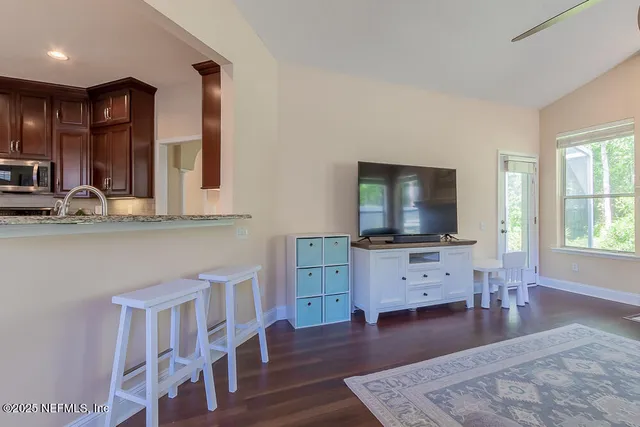a view of walk in closet with clothes