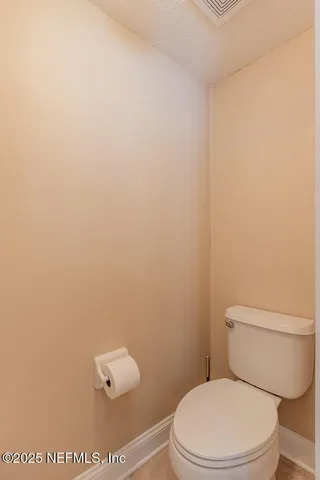 a bedroom with a bed couch and a window