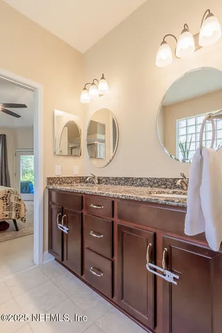 a living room with furniture and a glass door