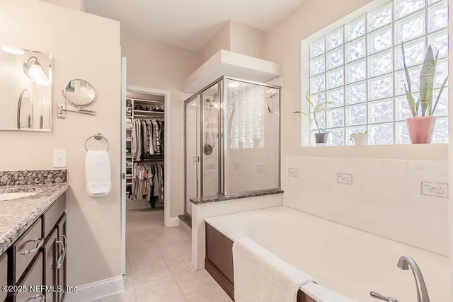 a view of a patio with table and chairs and potted plants