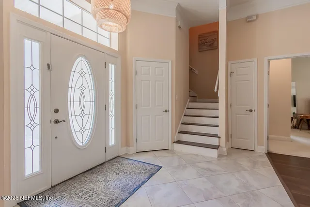 a kitchen with a sink counter and chairs