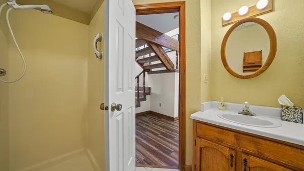 a bathroom with a sink and a mirror