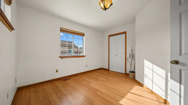 a view of an empty room and a window
