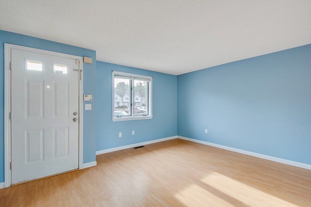 55 Littleton Road, Unit 29E Ayer, MA 01432 - Photo 7 of 20 an empty room with windows and closet area