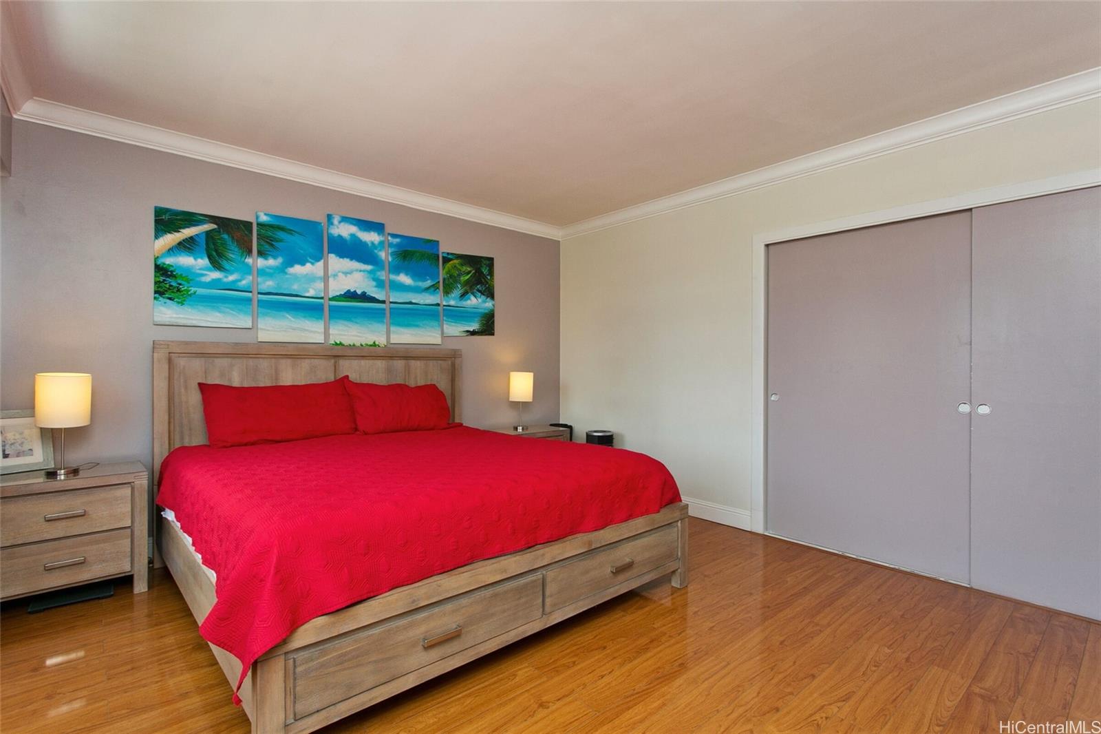 2015 Ala Wai Boulevard, Unit 8A Honolulu, HI 96815 - Photo 13 of 18 a bedroom with a bed and large window