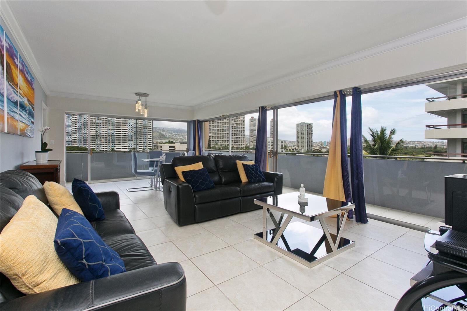 2015 Ala Wai Boulevard, Unit 8A Honolulu, HI 96815 - Photo 4 of 18 a living room with furniture and a floor to ceiling window