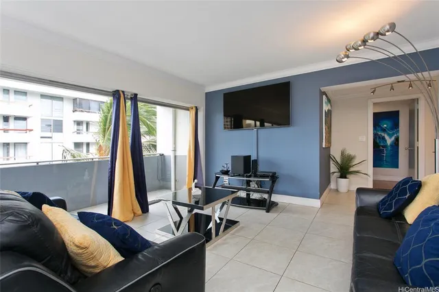 a living room with furniture and a flat screen tv