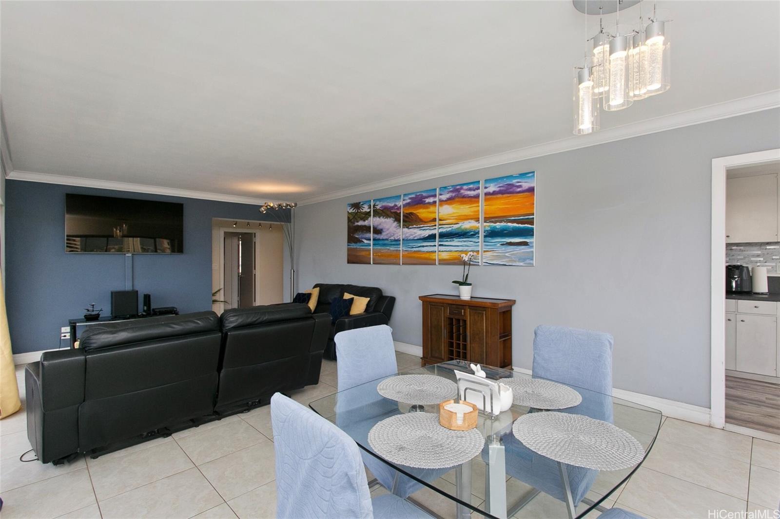 2015 Ala Wai Boulevard, Unit 8A Honolulu, HI 96815 - Photo 7 of 18 a living room with fireplace furniture and a flat screen tv