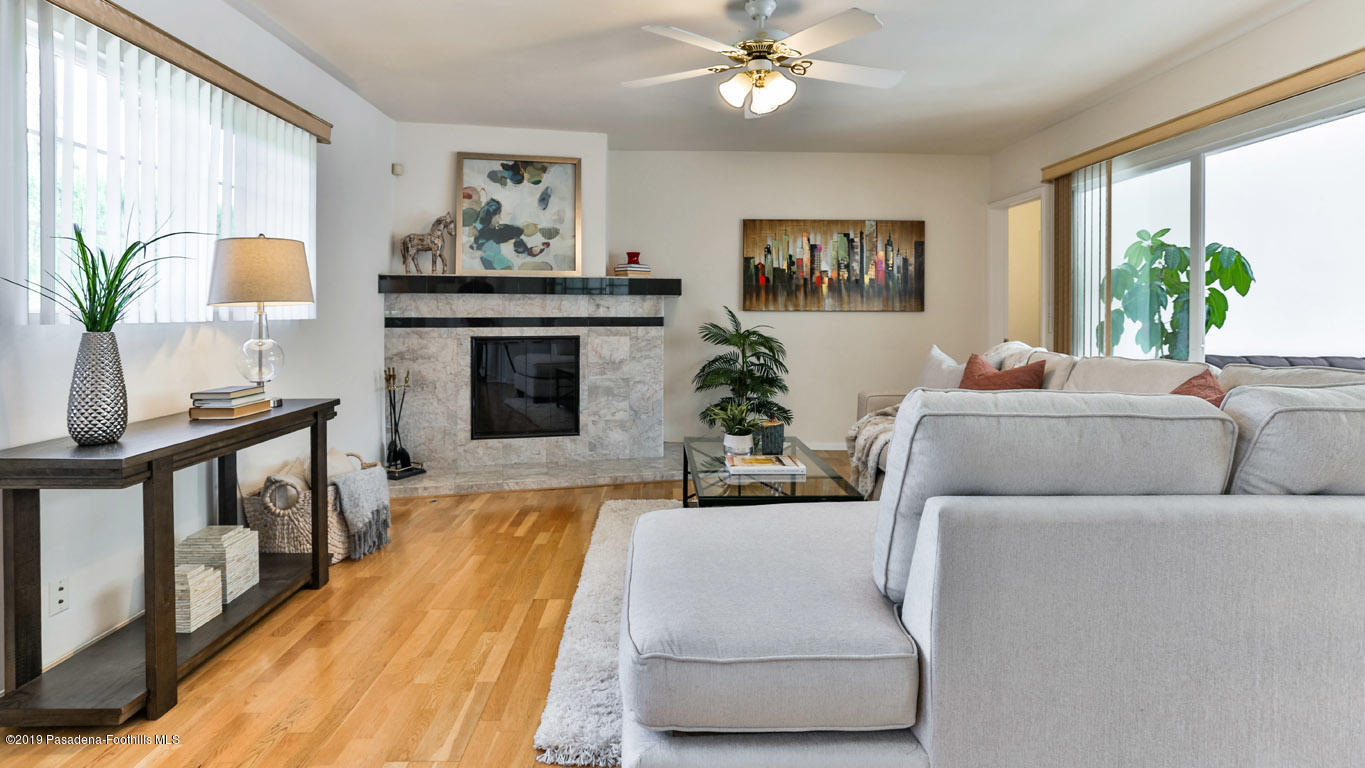 3810 Fairmeade Road Pasadena, CA 91107 - Photo 13 of 47 a living room with furniture and a fireplace