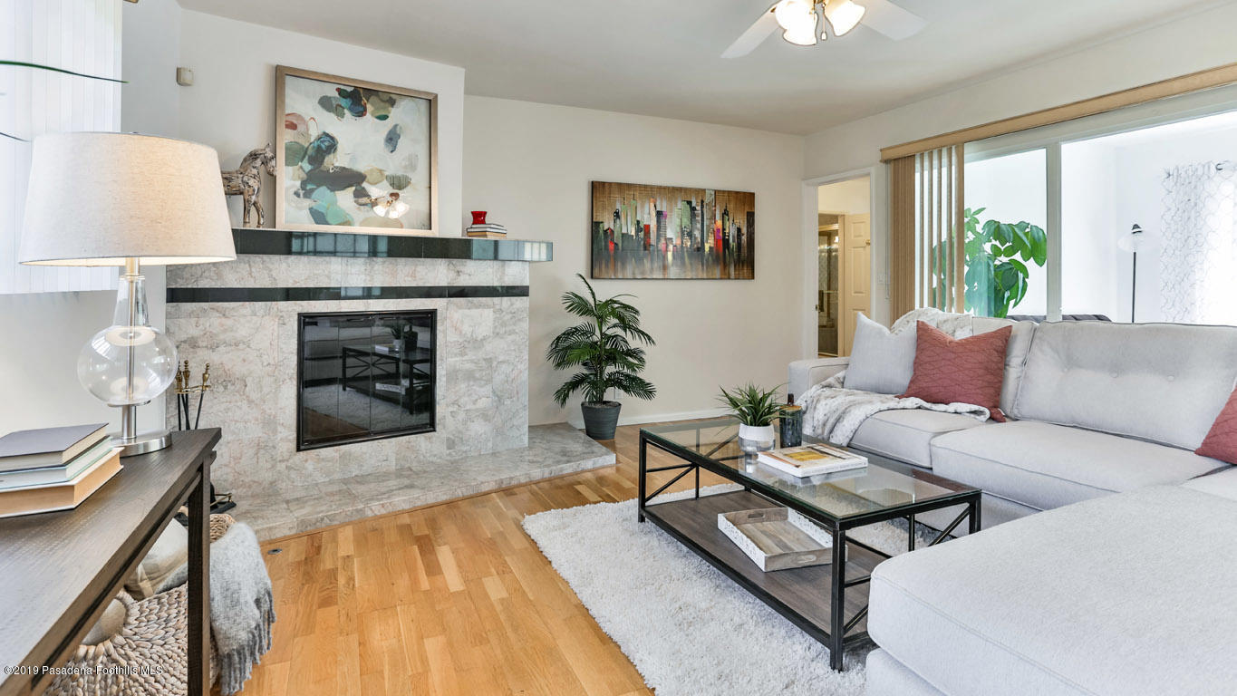3810 Fairmeade Road Pasadena, CA 91107 - Photo 14 of 47 a living room with furniture and a fireplace