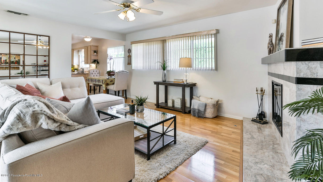 3810 Fairmeade Road Pasadena, CA 91107 - Photo 15 of 47 a living room with furniture and a chandelier