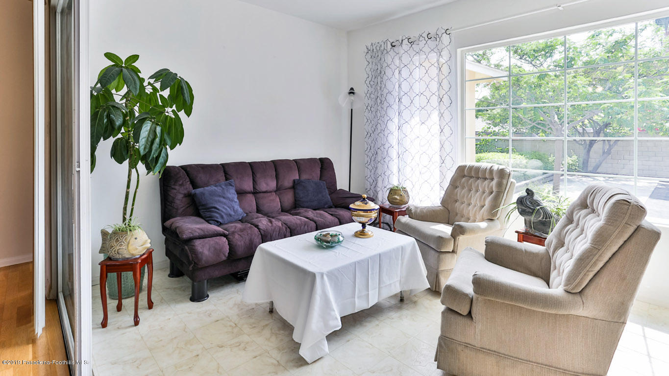 3810 Fairmeade Road Pasadena, CA 91107 - Photo 17 of 47 a living room with furniture plant and a window