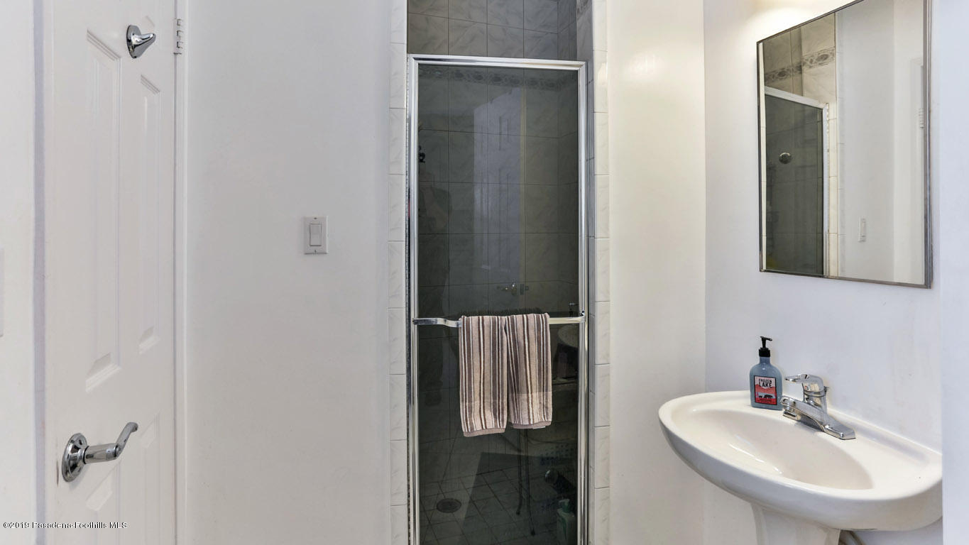 3810 Fairmeade Road Pasadena, CA 91107 - Photo 29 of 47 a bathroom with a sink and mirror
